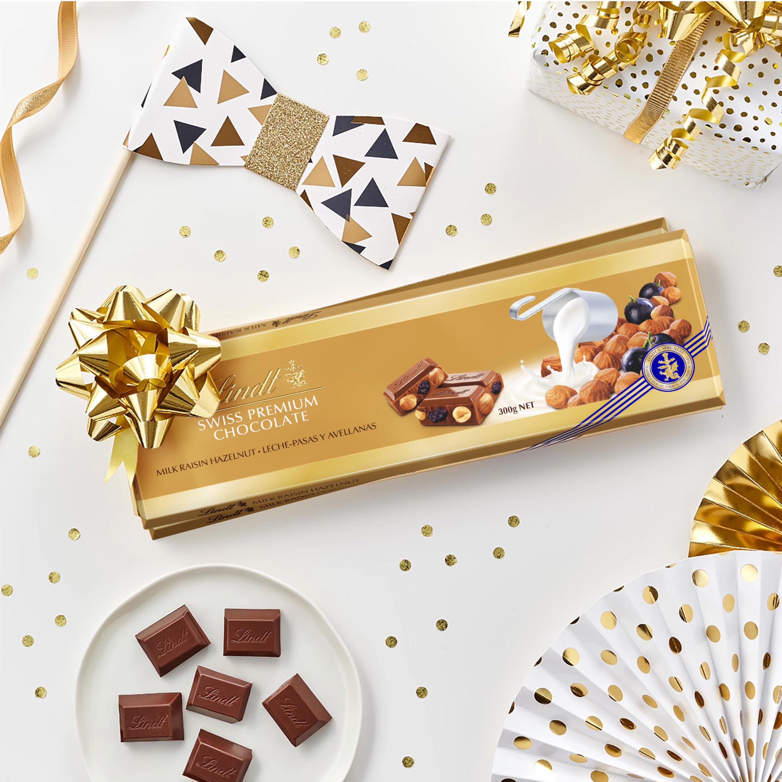 Lindt Schweizer Milchschokolade Haselnuss und Rosinen Goldtafel 300g 6